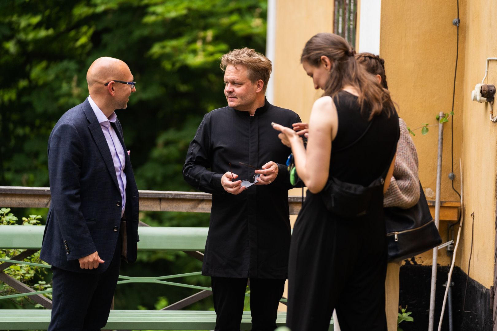 image of musicians talking outdoors