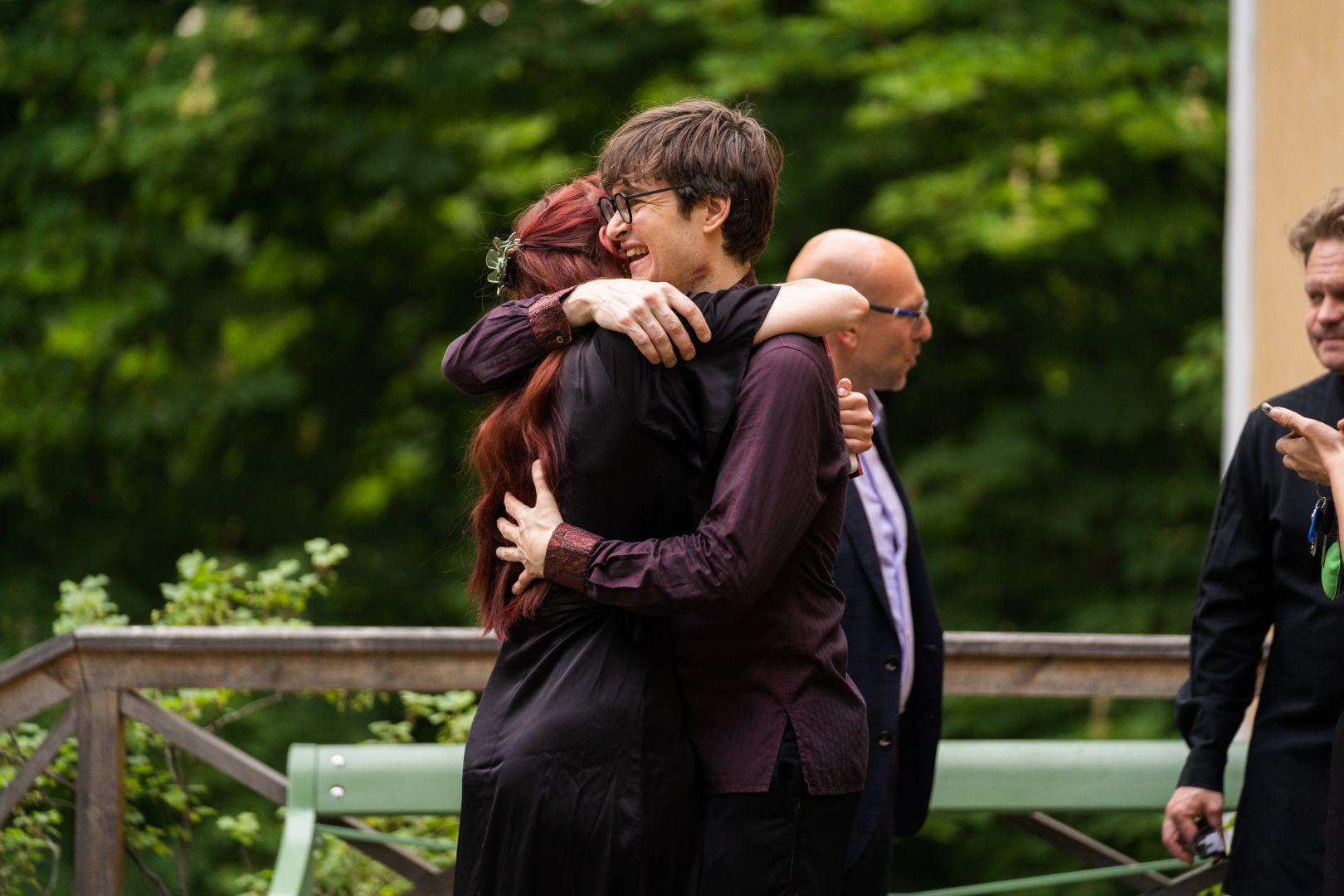 Image of happy musicians hugging